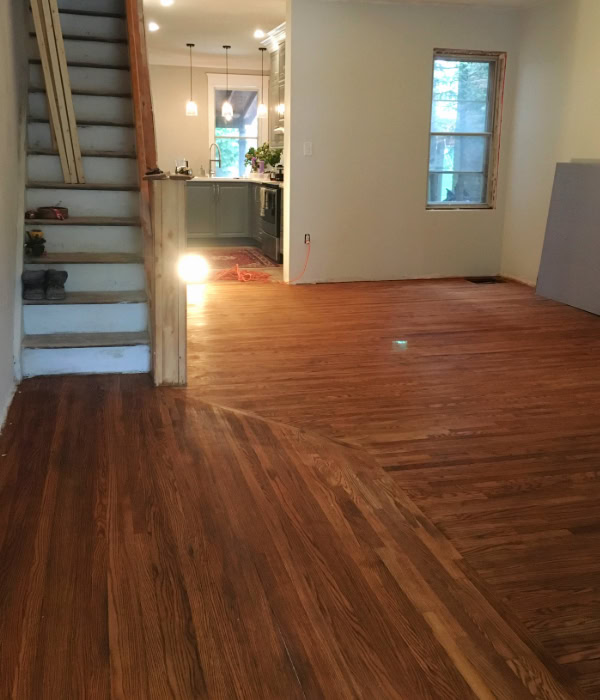The flooring, after sanding, with the first coat of stain.